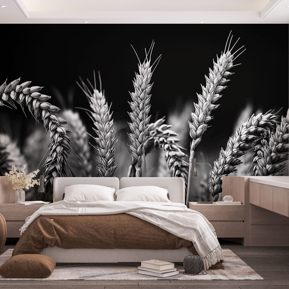Black and white wheat field wallpaper creating dramatic contrast in a modern dining room with natural lighting