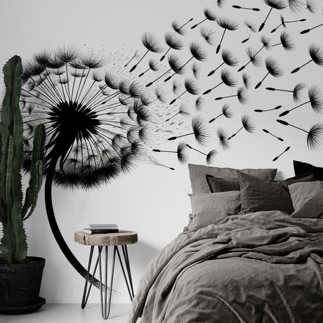 Black and white dandelion wallpaper creating a serene atmosphere in a modern living room with minimal furniture