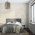Minimalist floral wallpaper in a bright modern living room showing beige nature patterns creating depth