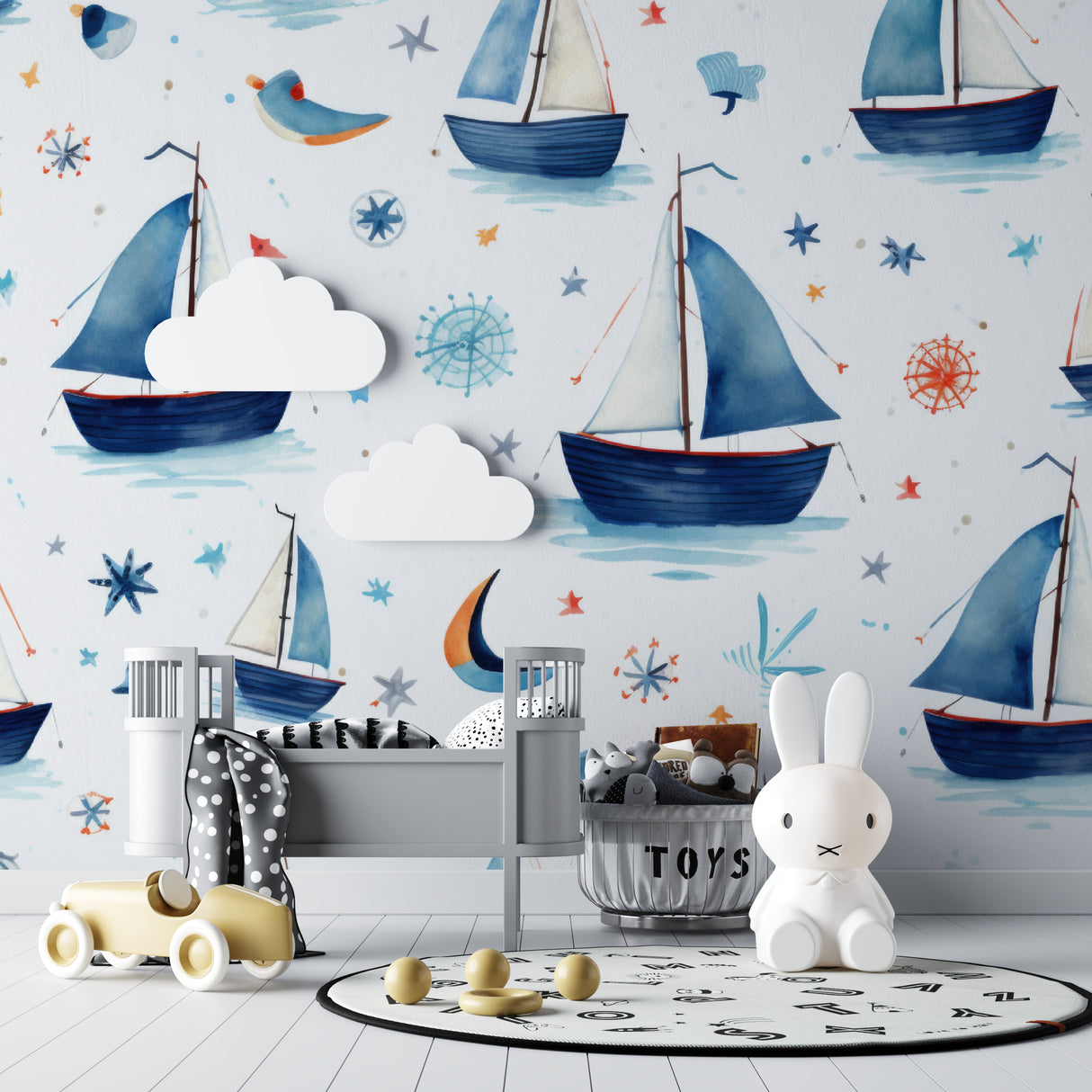 Sailboat wall mural bringing maritime charm to a child's bedroom with white furniture