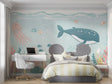 Ocean animals wallpaper displayed in a bright nursery with soft lighting and wooden furniture