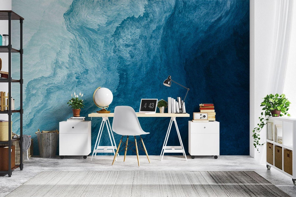 Abstract wave mural in a coastal-style bedroom showing deep blue tones