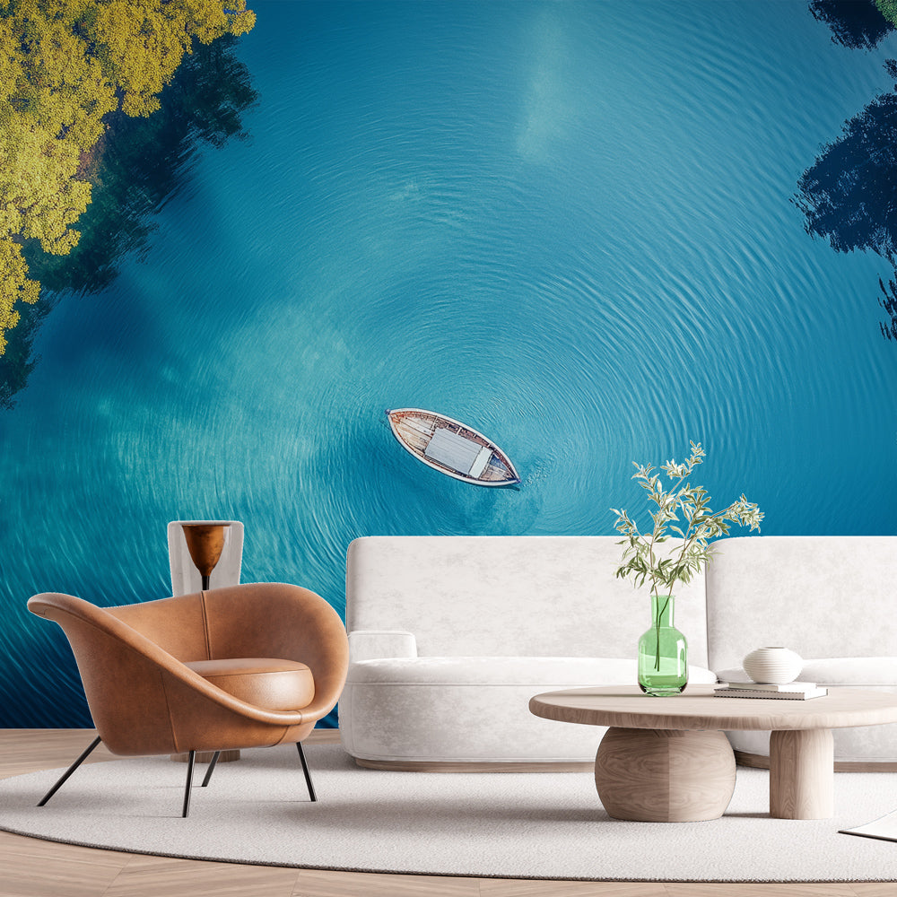 Turquoise ocean view wallpaper creating depth in a modern living room with natural light highlighting the aerial perspective