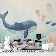 Ocean theme wallpaper creating a peaceful nursery atmosphere with gentle whale and jellyfish design