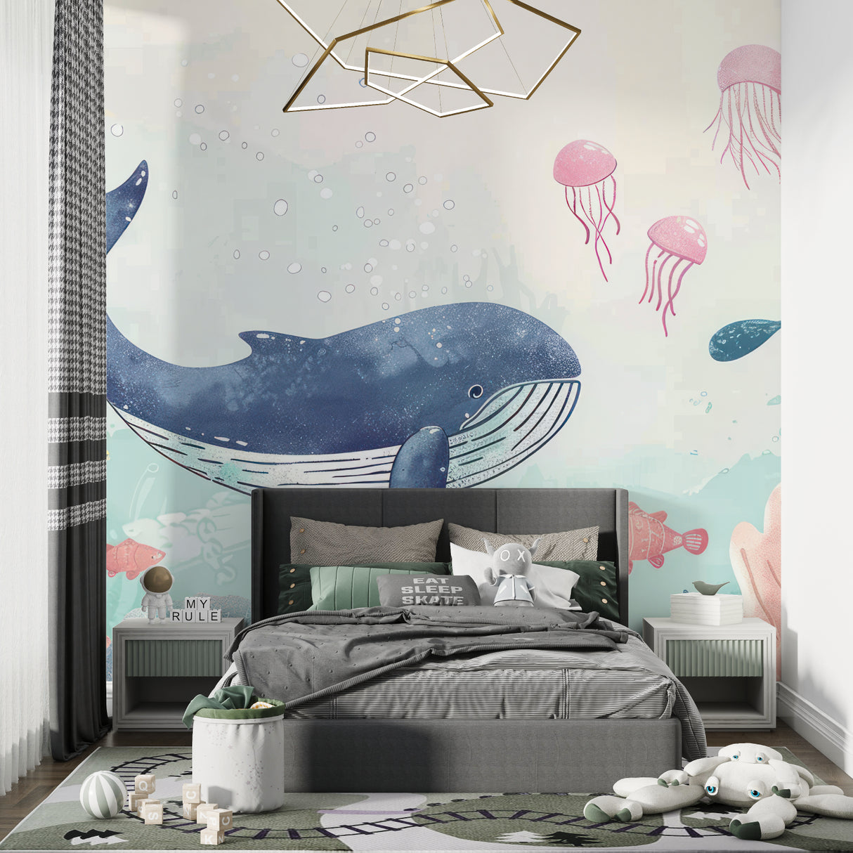 Kids bedroom transformed with underwater whale wallpaper mural showing soft pink and blue tones