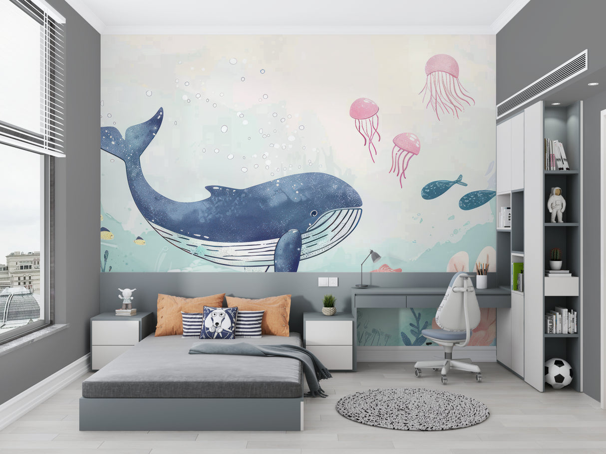 Ocean theme nursery wall with blue whale and pink jellyfish mural creating calm environment