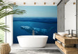 Blue Whale underwater wallpaper mural displayed in a modern minimalist bedroom, creating a peaceful ocean atmosphere