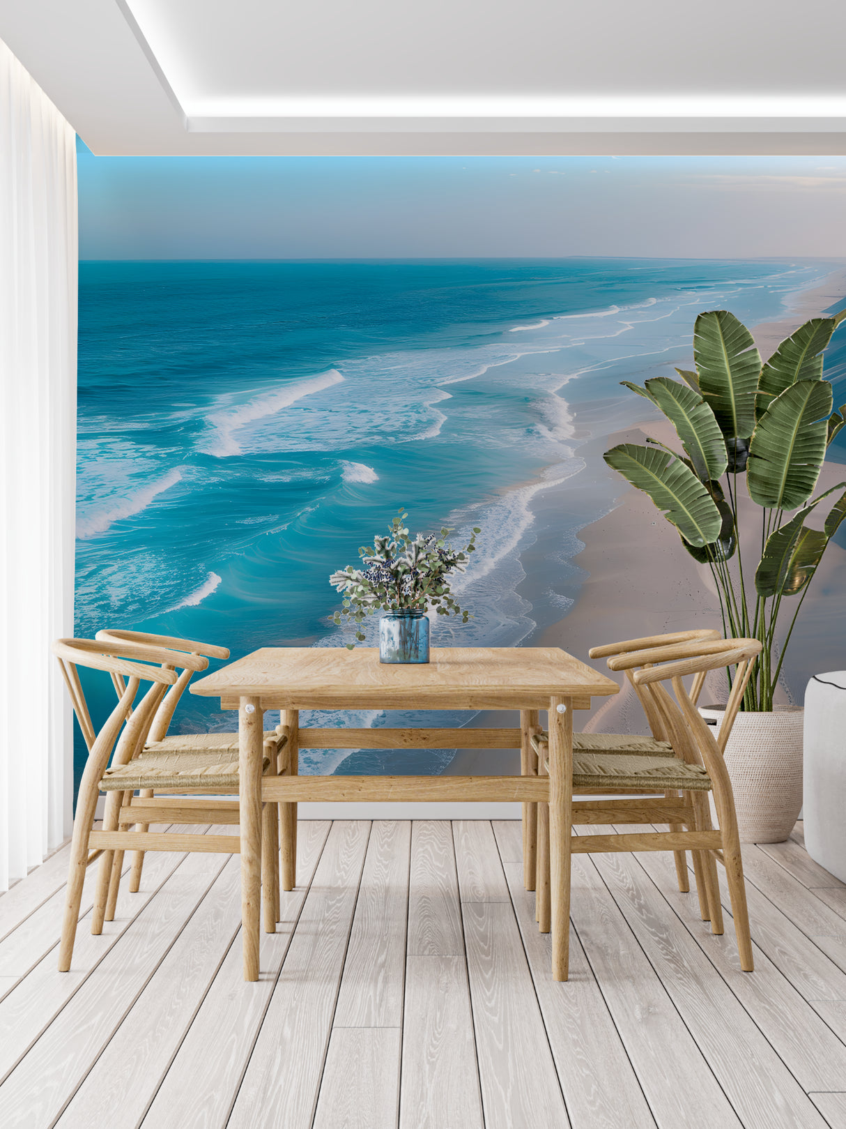 Ocean mural wallpaper in modern living room showing turquoise waves meeting golden sand