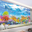 Ocean mural wallpaper bringing underwater magic to a modern living room with coral reef and dolphins