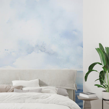 Ocean landscape wallpaper creating a serene atmosphere in a modern living room with natural light