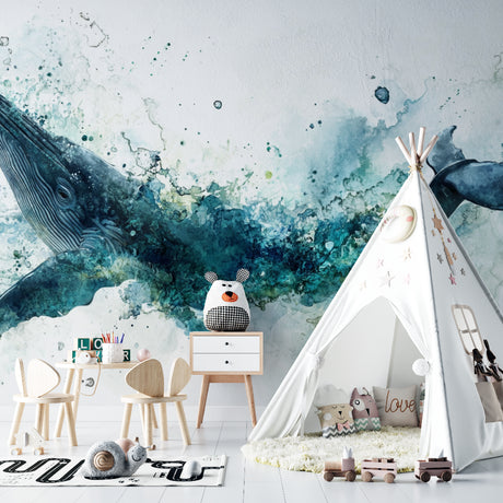 Ocean theme wallpaper with watercolor whale shown in bright modern nursery, creating a peaceful underwater atmosphere