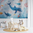 Ocean theme wallpaper creating a magical underwater scene in a modern nursery with soft blue walls