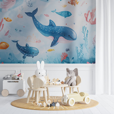 Ocean theme wallpaper creating a magical underwater scene in a modern nursery with soft blue walls