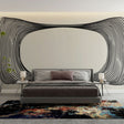 Modern office space featuring a striking Optical Illusion wallpaper with black curved lines creating depth on white background