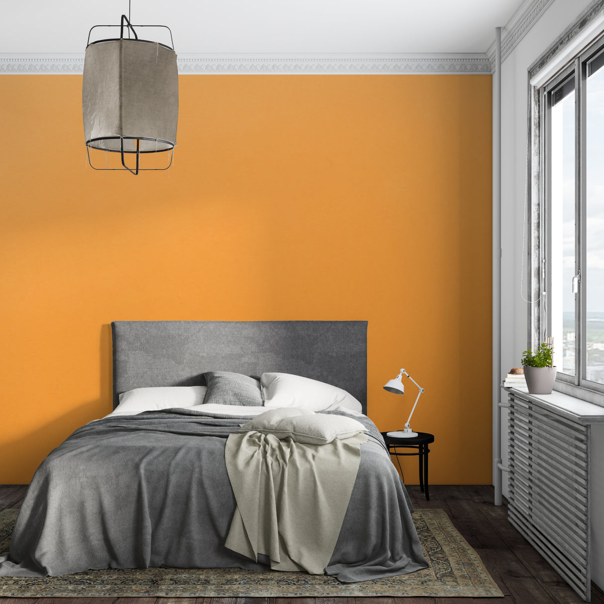 Terracotta feature wall in dining room creating warm ambiance with wooden table