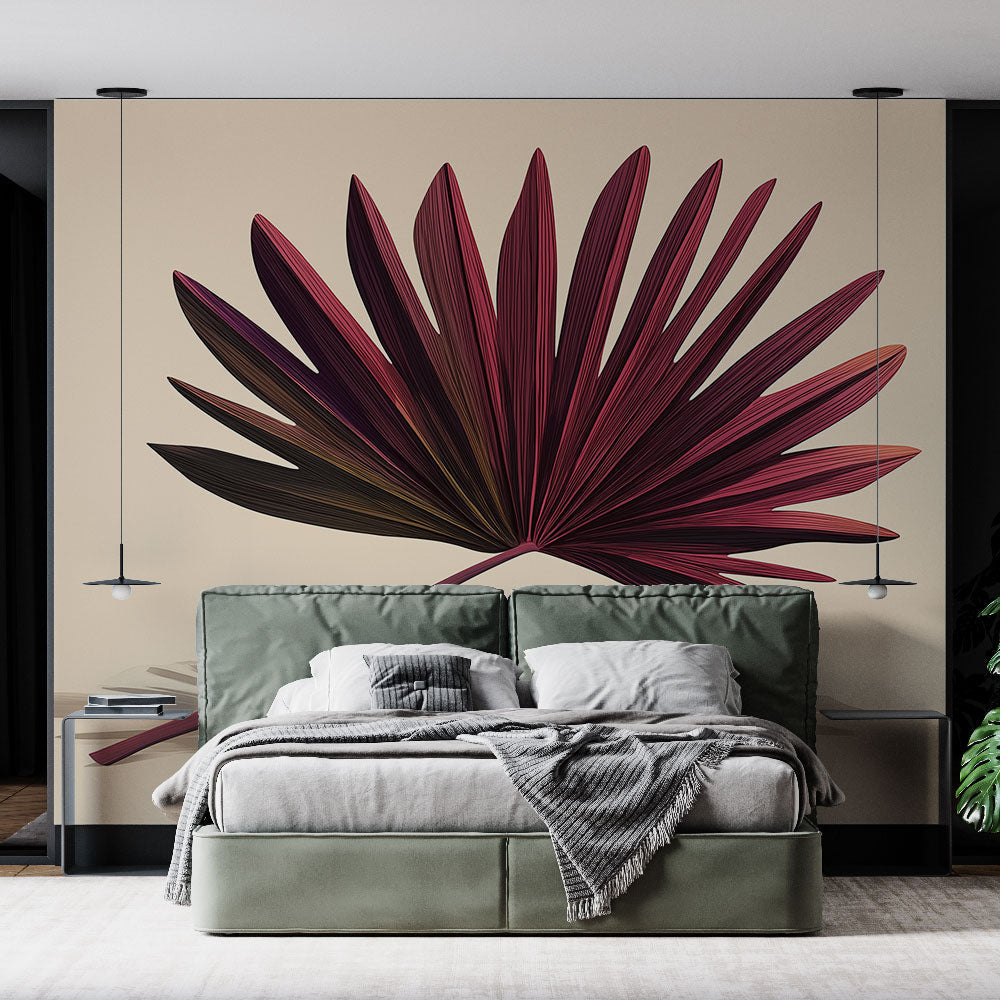 Burgundy palm leaf wallpaper creating a stunning focal point in a modern living room with gray sofa and natural light
