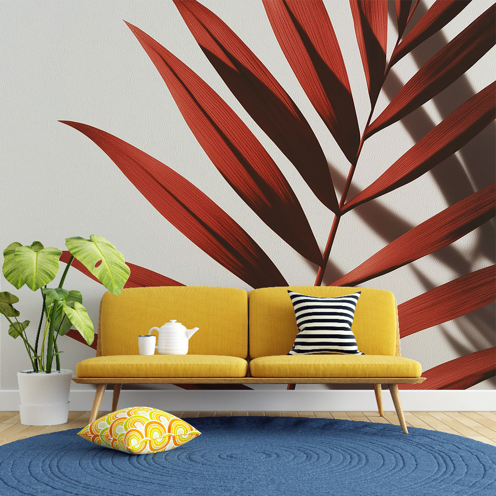 Terracotta palm leaf wallpaper making a bold statement in a bright modern living room with minimal furniture