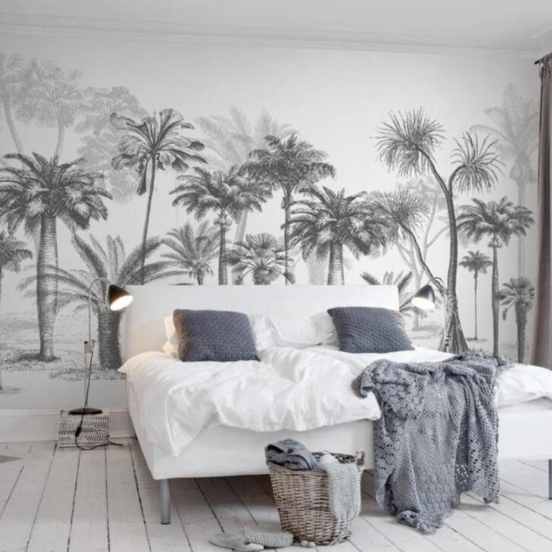Black and white palm tree wallpaper creating a bold statement wall in a modern living room with minimalist furniture