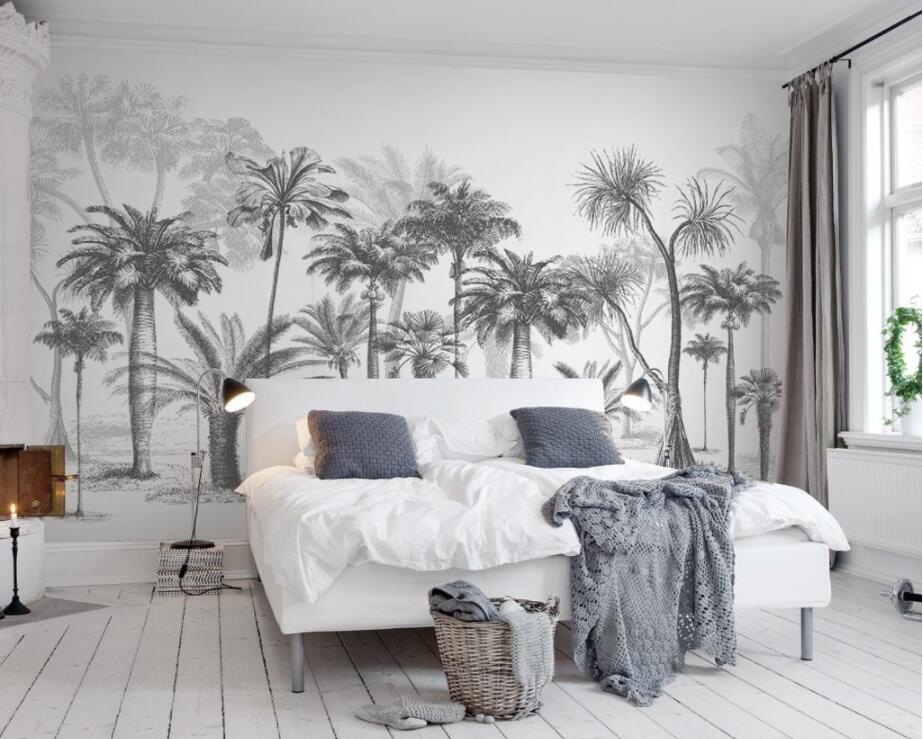 Black and white palm wallpaper adding depth to a home office with contemporary furnishings