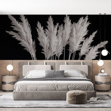 Black and white pampas grass wallpaper creating a bold statement wall in a minimalist living room with natural light