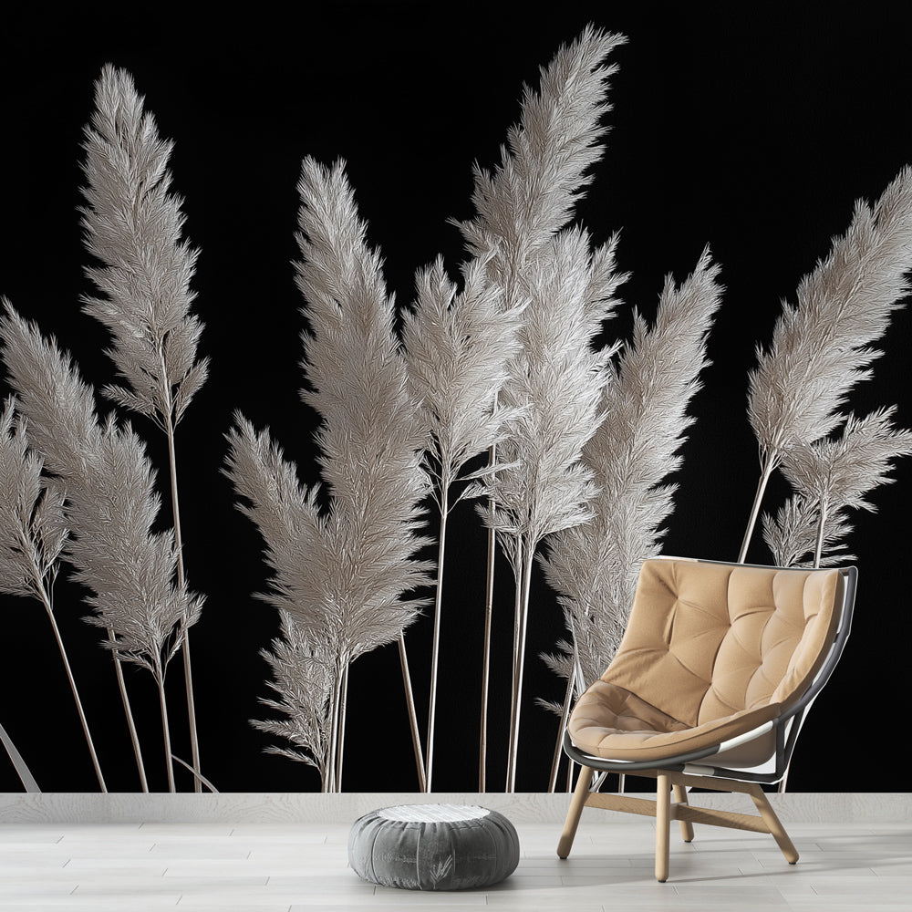 Black and white pampas grass wallpaper creating drama in a modern living room with minimal furniture