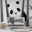 Black and white panda wallpaper creating a calm atmosphere in a modern nursery with minimalist furniture