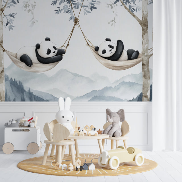 Panda wallpaper mural styled in modern nursery with white furniture and natural light