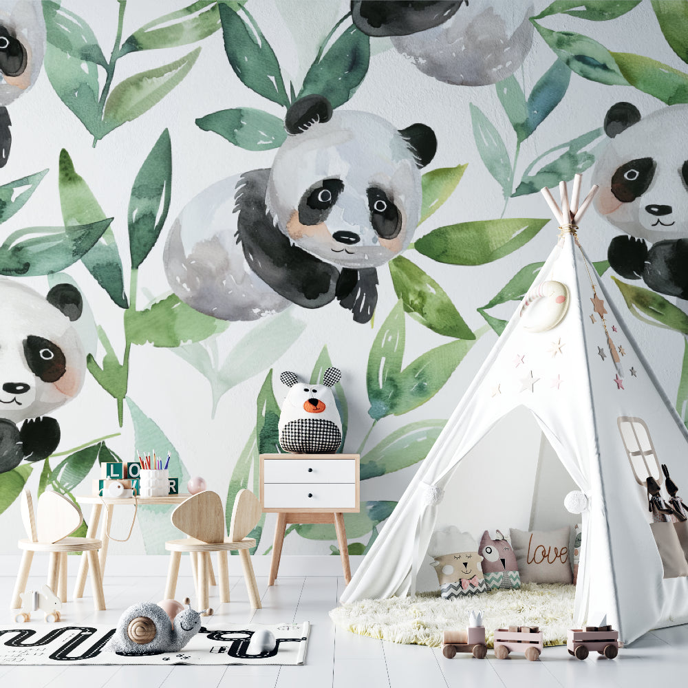 Panda wallpaper mural in a bright nursery with white furniture showing playful watercolor pandas