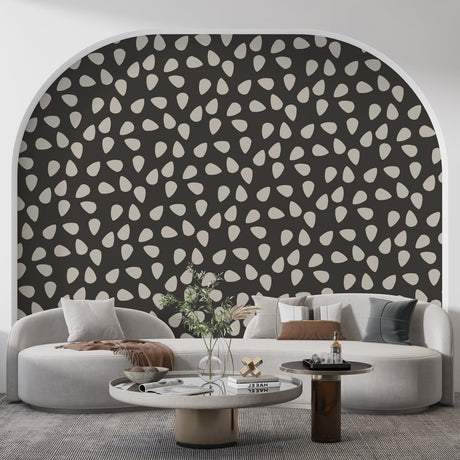Modern abstract pattern wallpaper with white drops shown in a minimalist living room, creating dramatic contrast against furniture