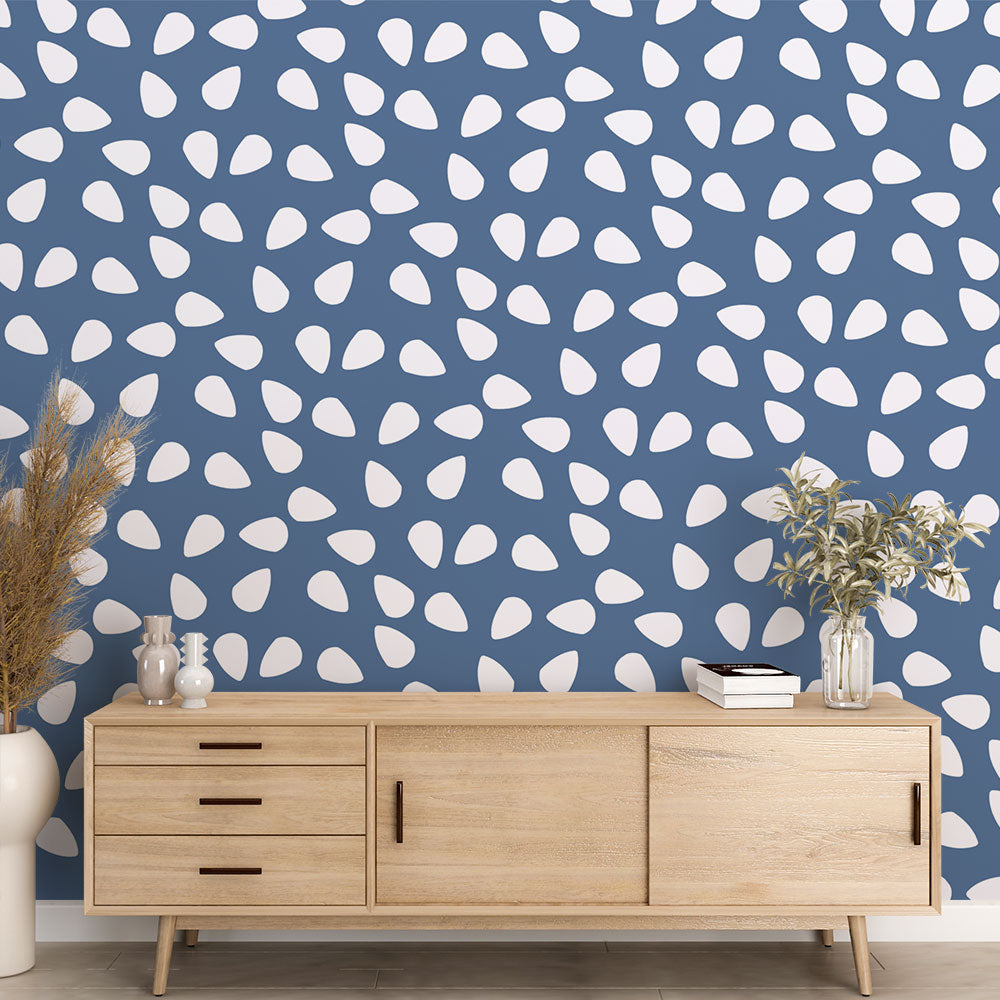Modern living room featuring blue pattern wallpaper with white drops, creating a peaceful atmosphere