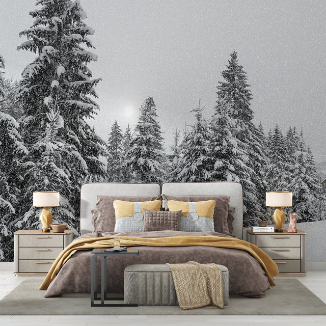 Black and white pine tree wallpaper creating a cozy atmosphere in a modern living room with minimal furniture