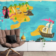 Pirate treasure map wallpaper bringing adventure to a modern kids bedroom with blue and white decor