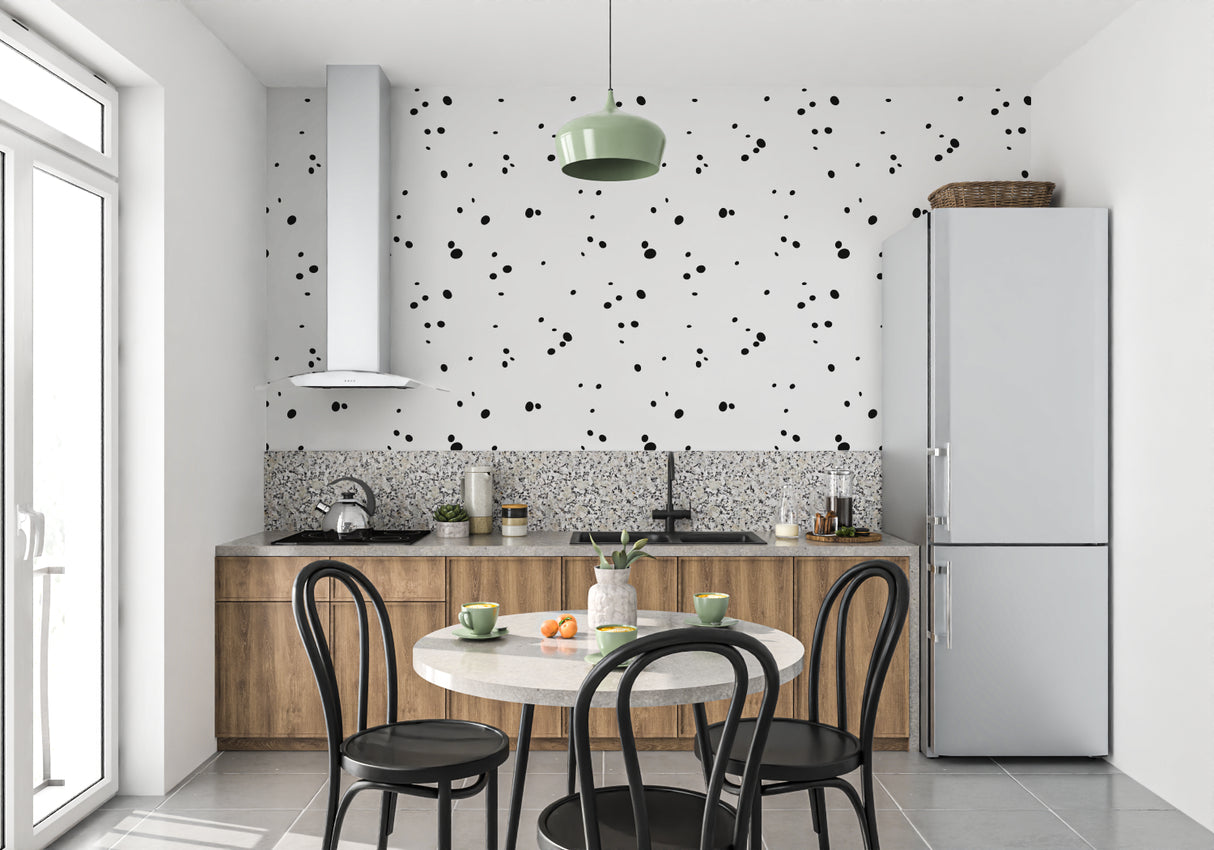 Black dot pattern wallpaper creating a striking accent wall in an entryway