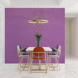 Purple textured wallpaper in modern dining room with pendant lighting highlighting the subtle surface details