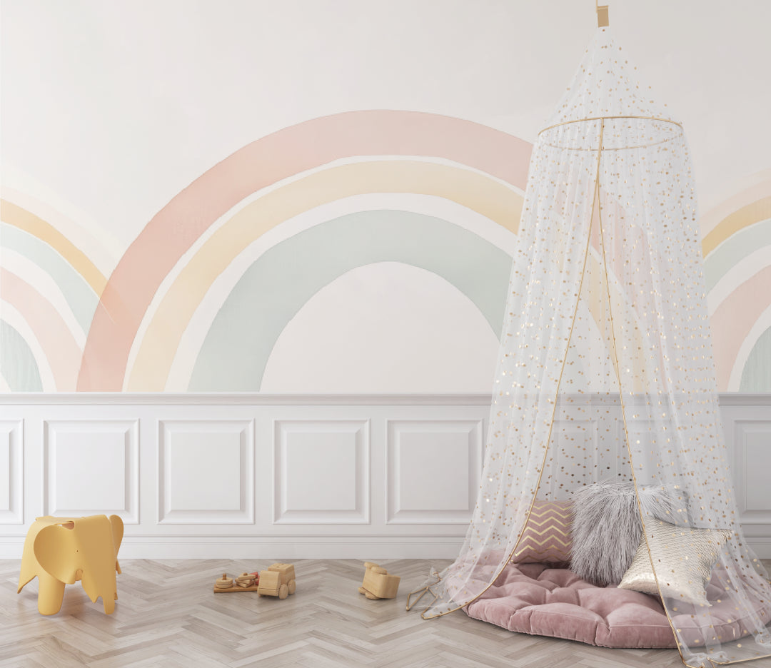 Boho rainbow wallpaper in playroom with wooden toys and soft textiles