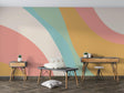 Rainbow wave wallpaper creating a dreamy atmosphere in a modern living room with natural light