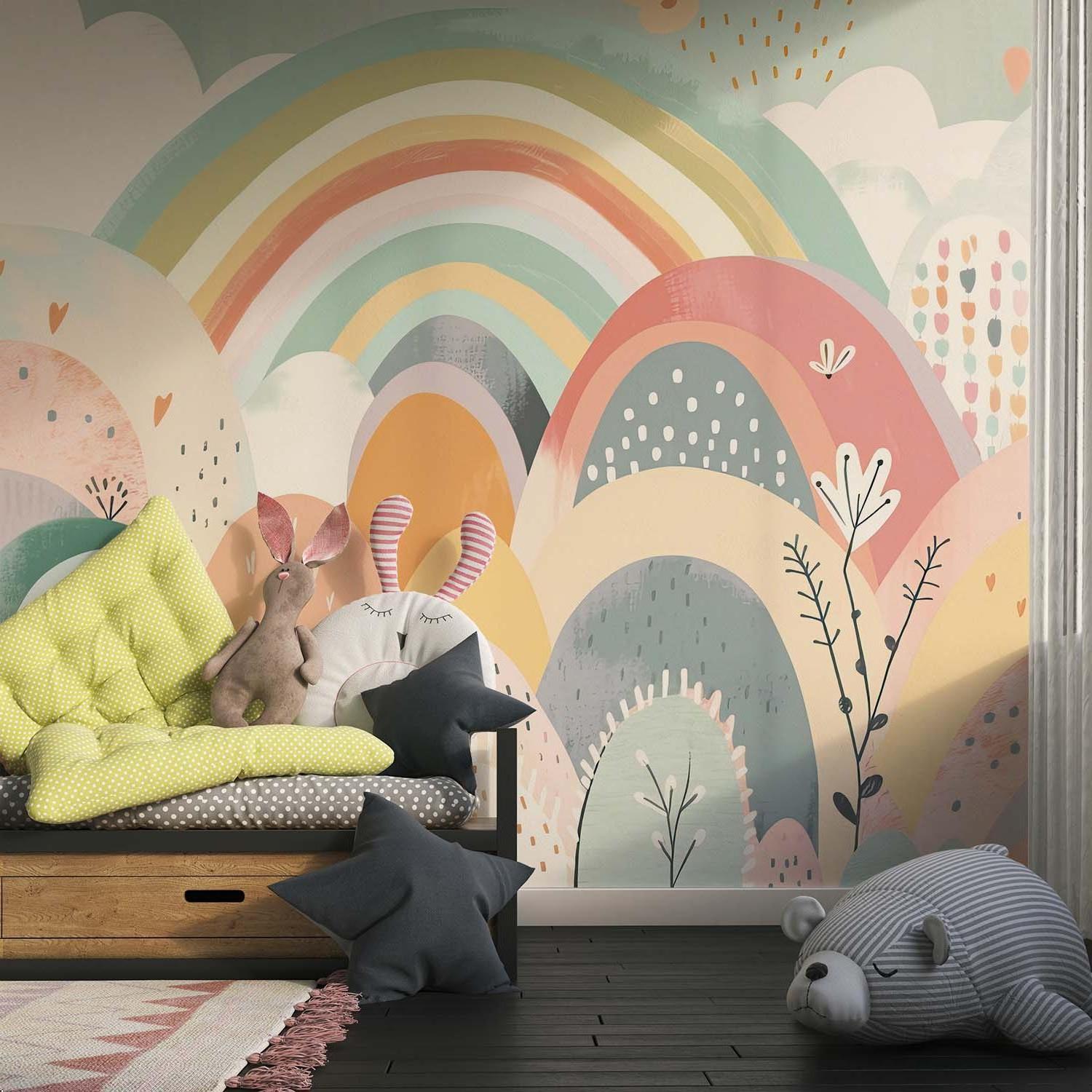 Boho rainbow wallpaper creating a calming atmosphere in a toddler's bedroom