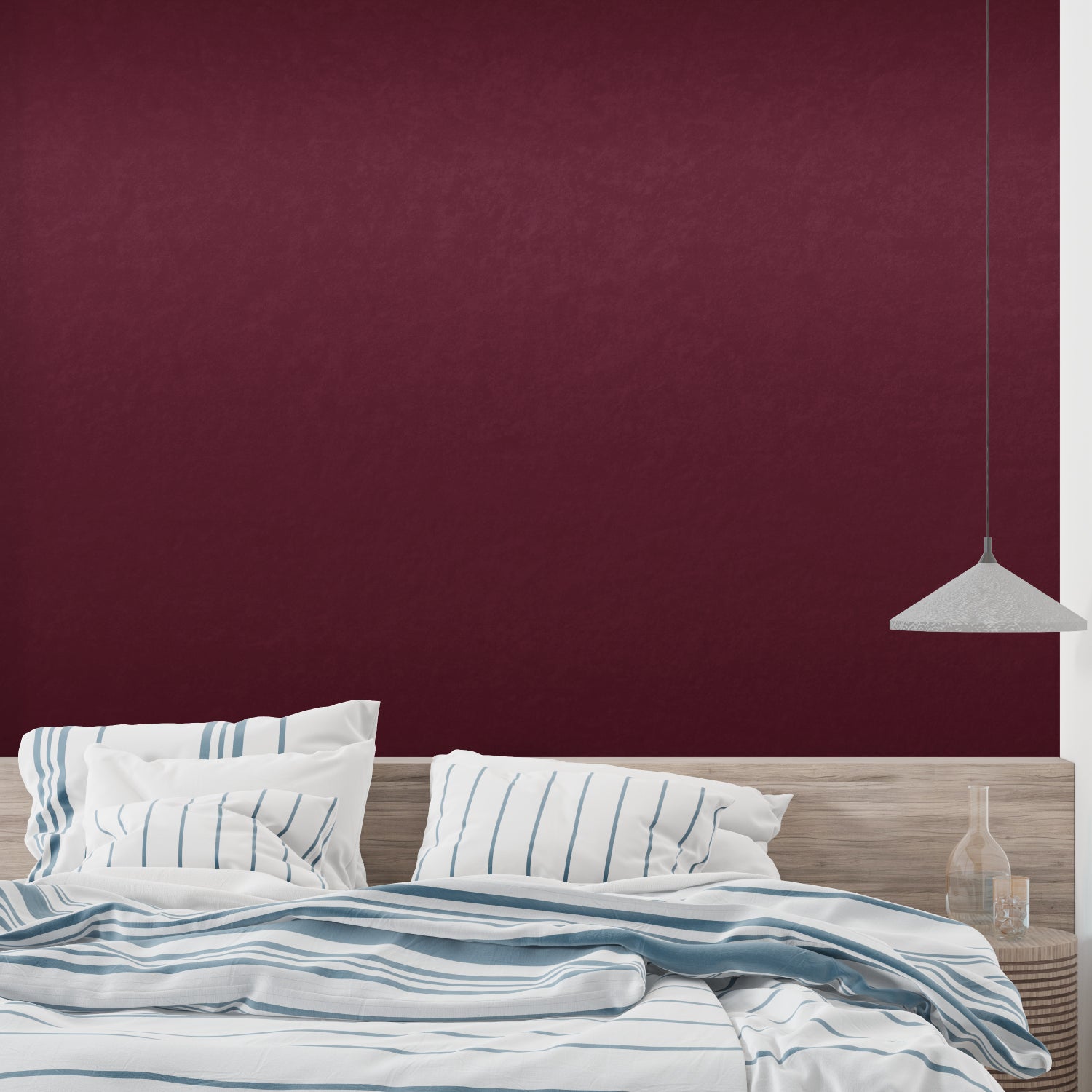 Red wallpaper creating cozy atmosphere in master bedroom with white furniture