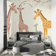 Safari giraffe wallpaper in a bright nursery with white furniture showing scale and peaceful atmosphere