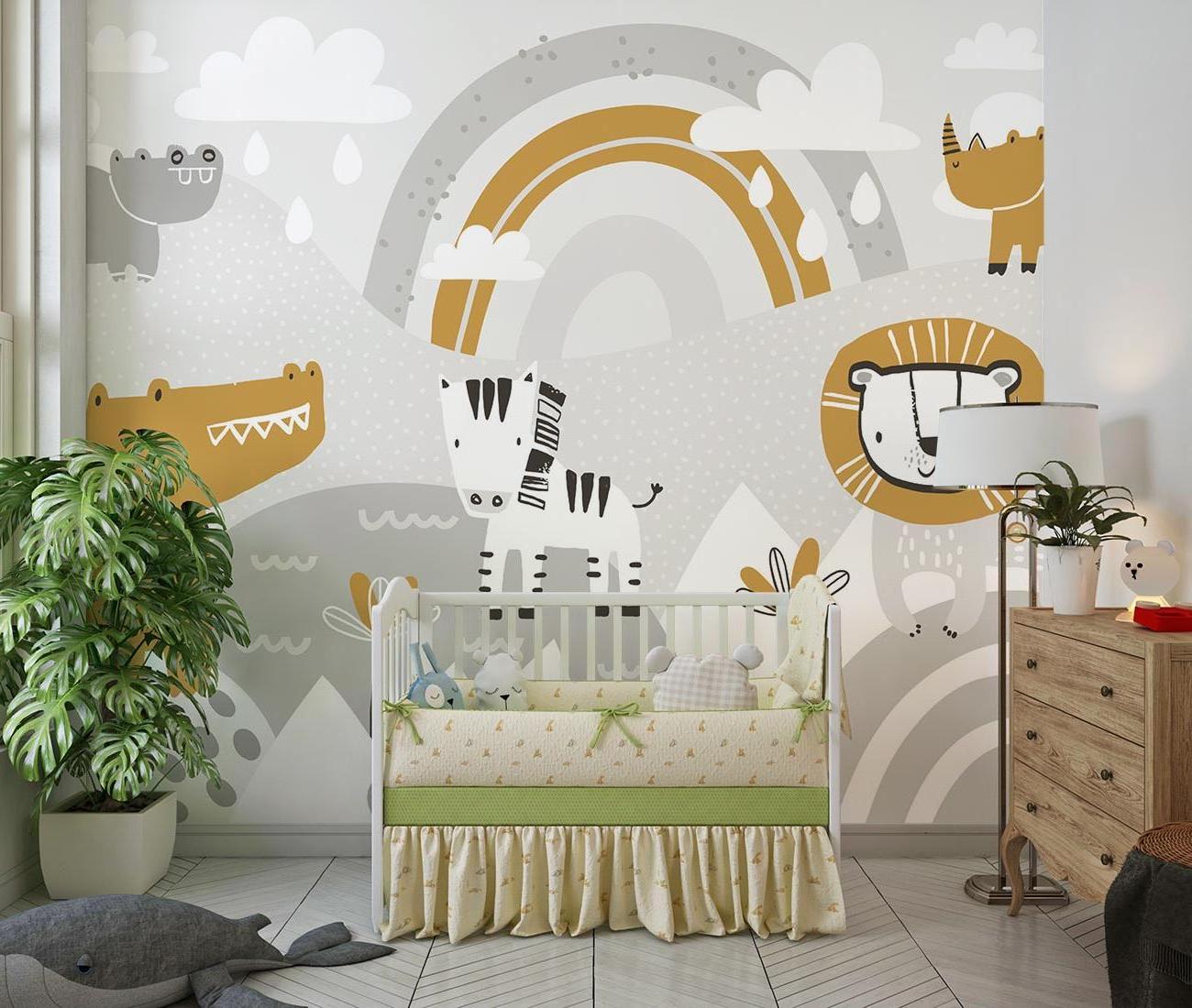 Safari themed nursery with gold and grey animal wallpaper creating a cozy atmosphere