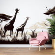 Black and white safari wallpaper with giraffe silhouettes creating depth in a modern minimalist living room