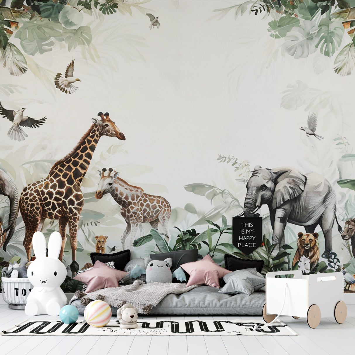 Safari animals wallpaper mural in bright nursery with white furniture showcasing gentle wildlife theme