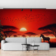 African savanna wallpaper with red sunset and zebra creating a warm atmosphere in a modern living room