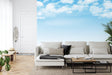 Sky mural wallpaper creating an airy atmosphere in a modern living room with natural light