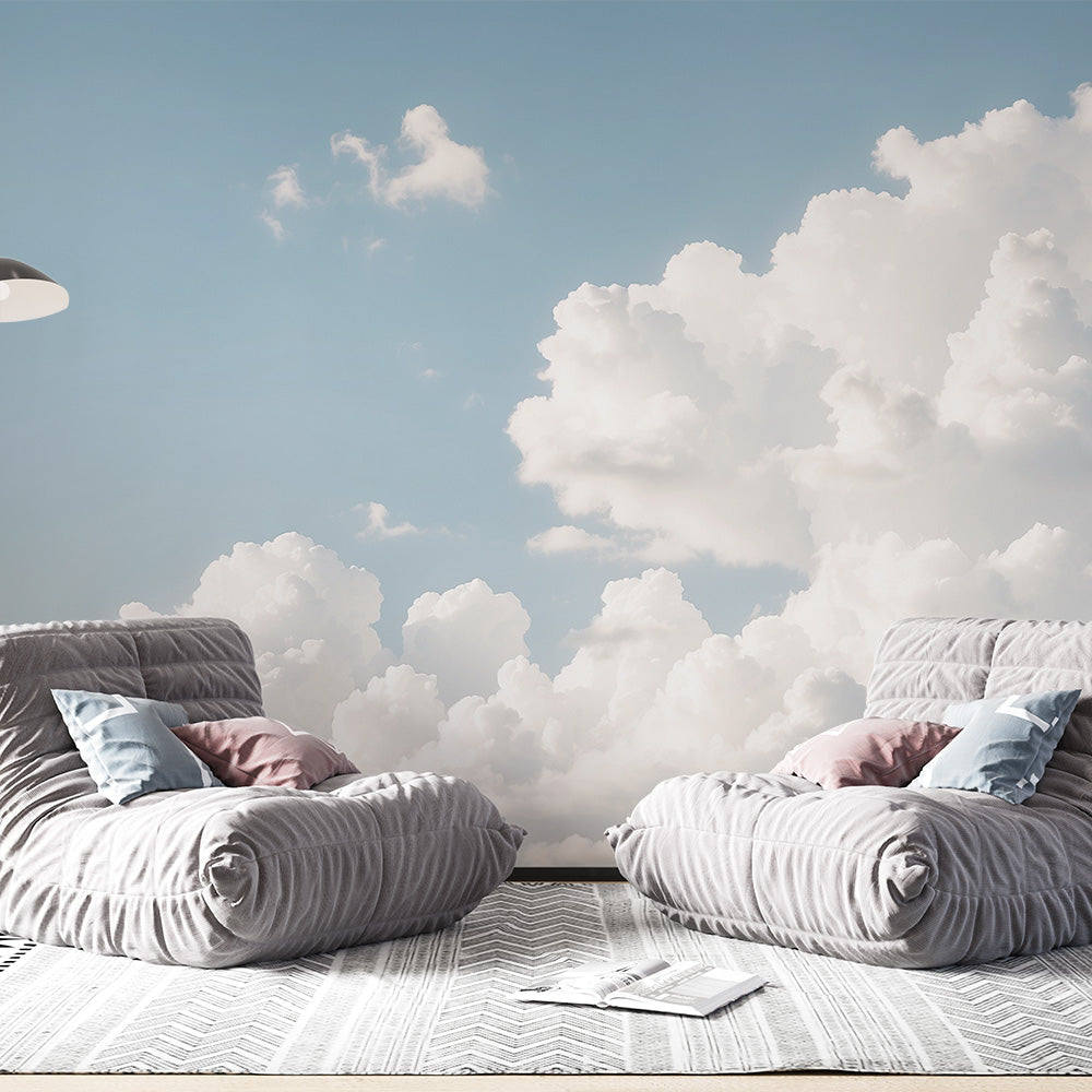 Cloud mural wallpaper creating a peaceful atmosphere in a modern living room with natural light