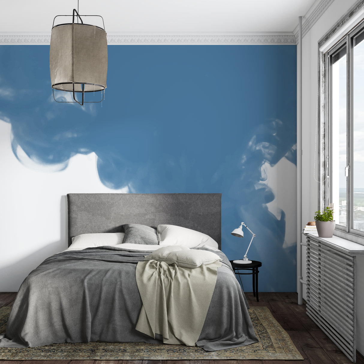 Blue sky wallpaper creating depth in modern living room with natural light