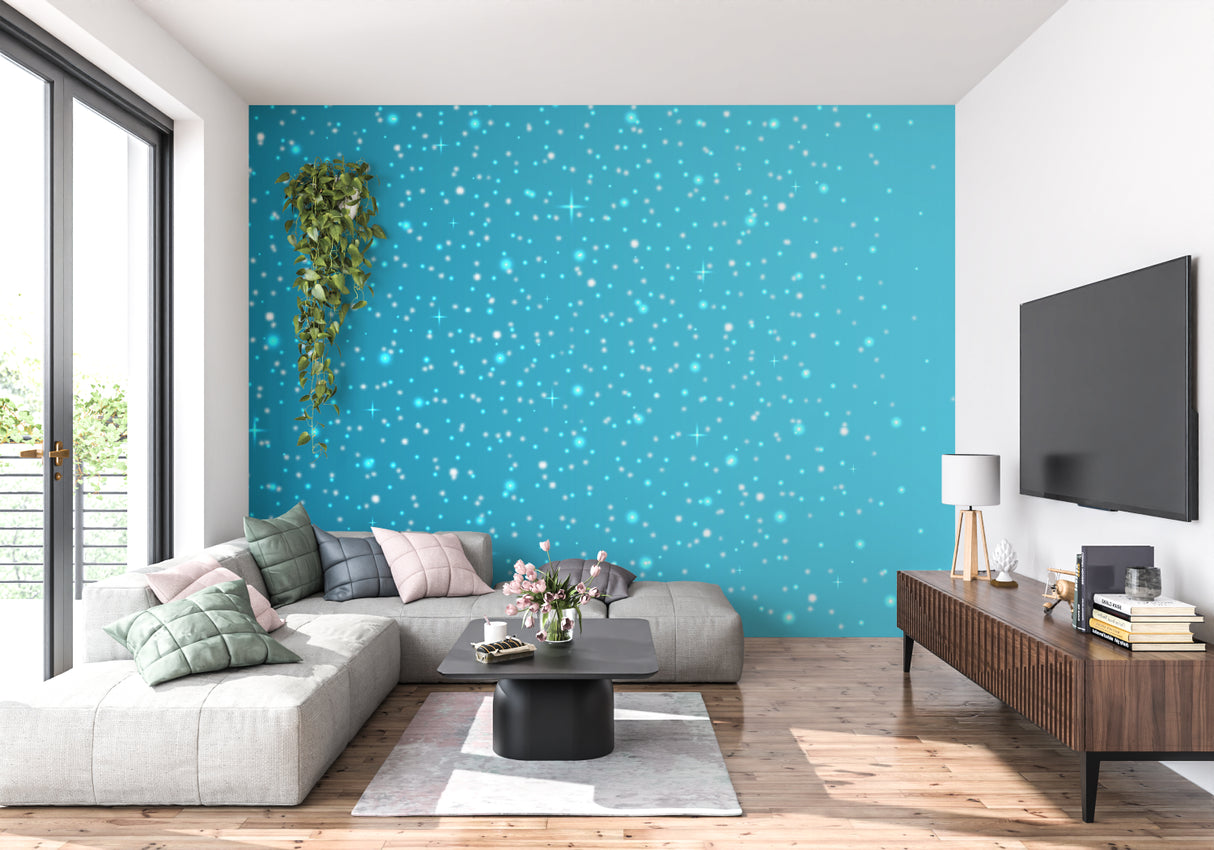 Reading nook with star pattern wall mural in soft turquoise tones