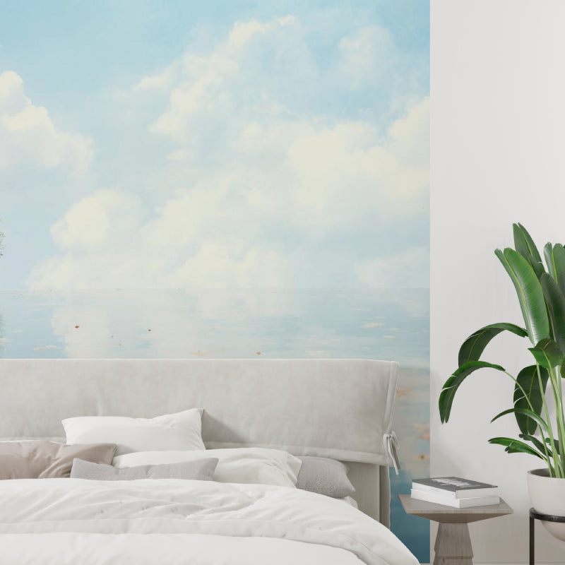 Cloud mural wallpaper creating an airy atmosphere in a modern living room with natural light