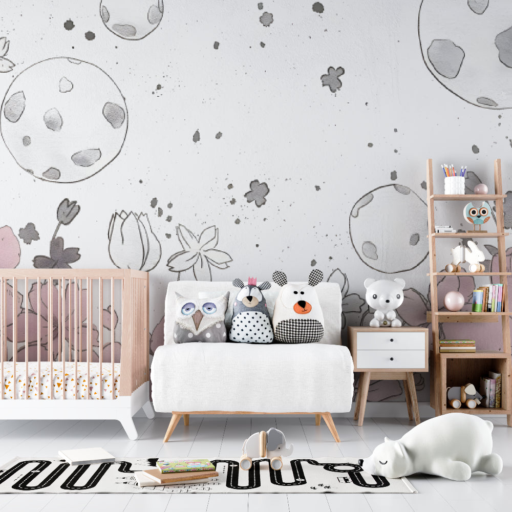 Space floral wallpaper creating a dreamy atmosphere in a modern nursery with white furniture