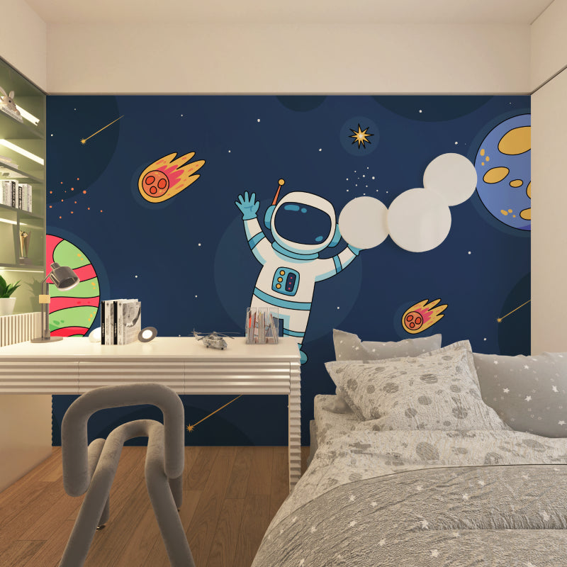 Astronaut mural wallpaper displayed in modern game room with space-themed elements
